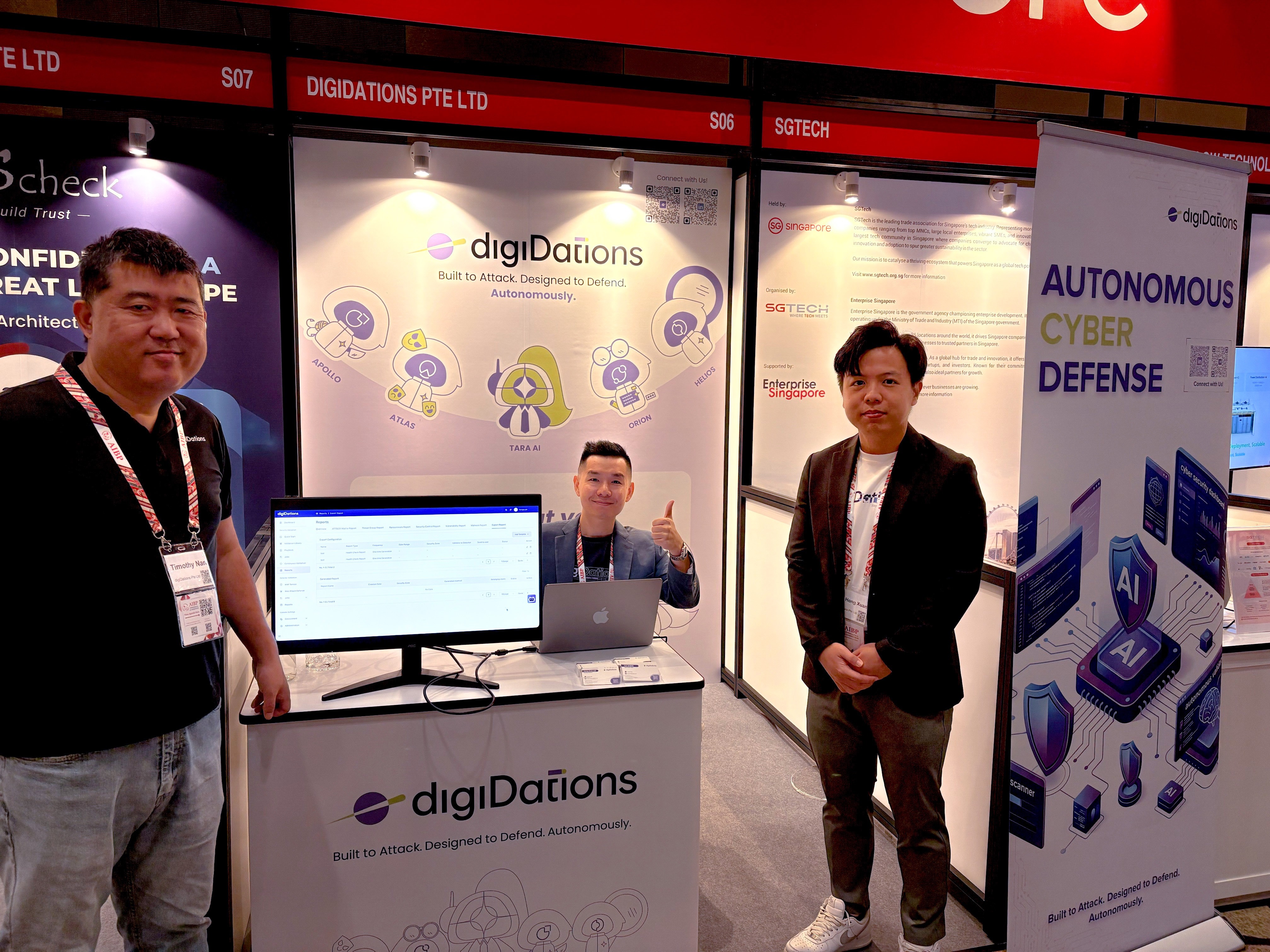 digiDations exhibition booth at AIBP 2026, with team members beside a laptop demo station under the Autonomous Cyber Defense banner