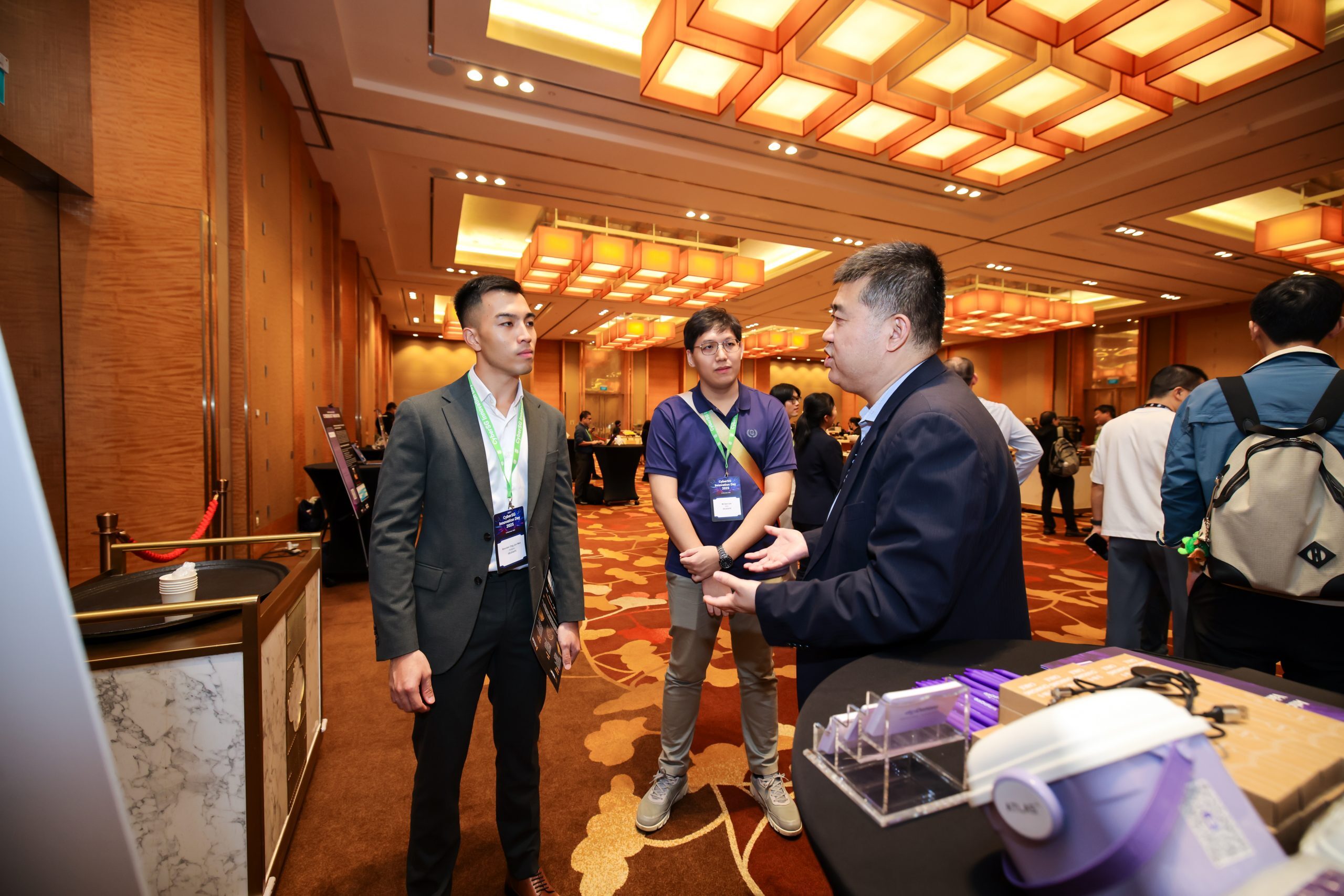 digiDations team members talking with attendees at CyberSG Innovation Day 2025