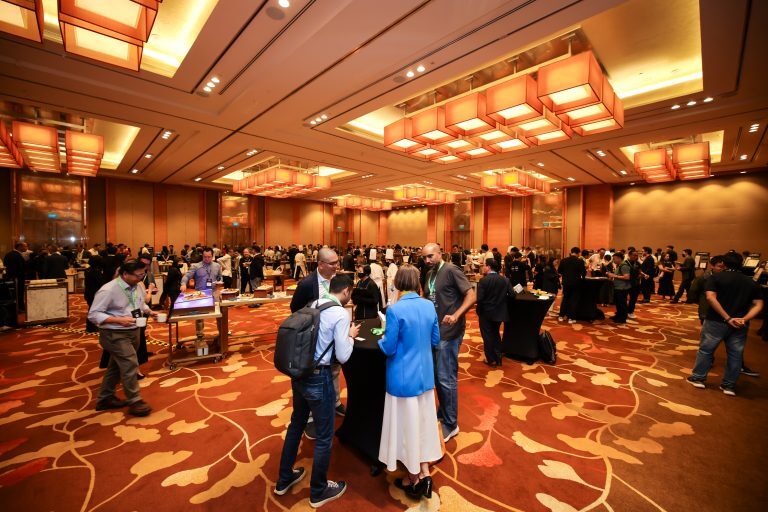 Delegates networking in the main hall at CyberSG Innovation Day 2025