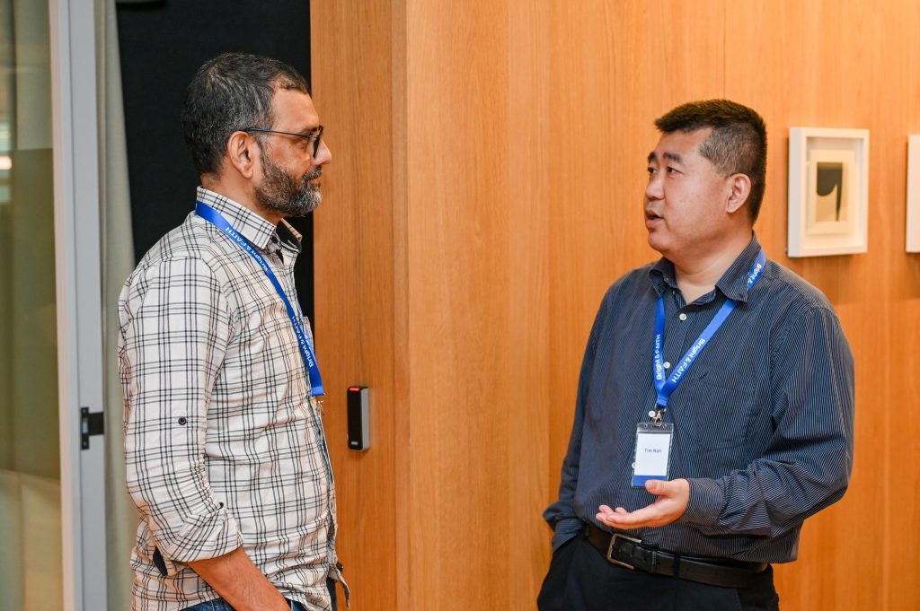 Two attendees in conversation at the BAS Blockchain Security Salon