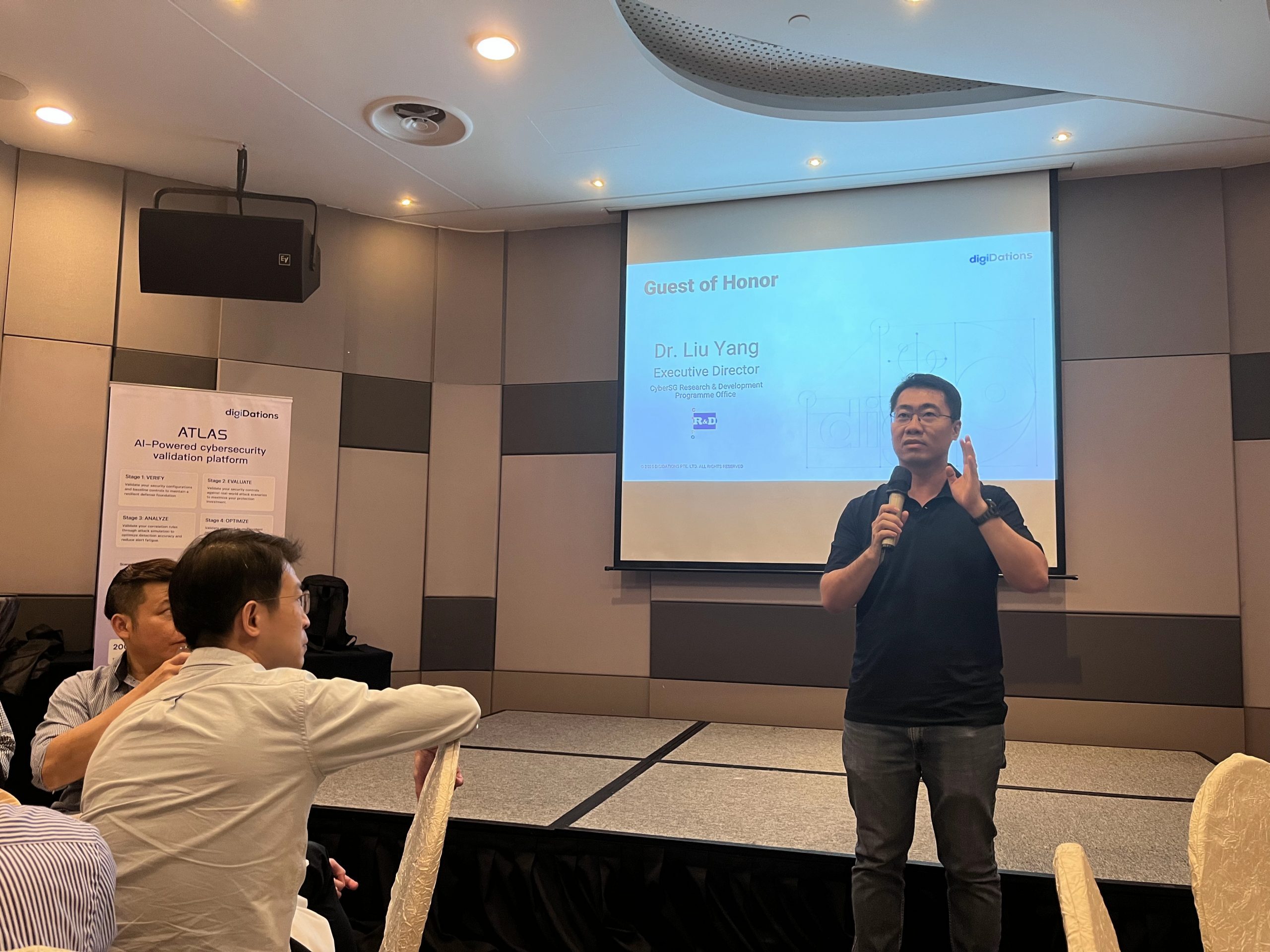 Speaker presenting to guests at the CISO exclusive dinner on continuous validation