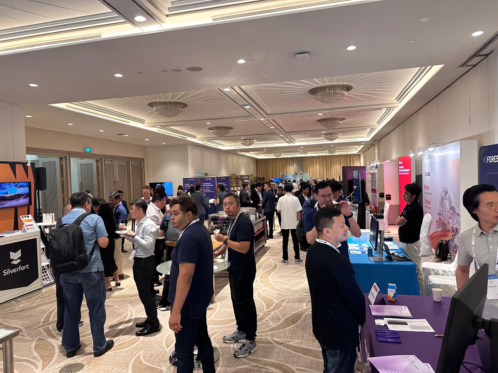Attendees networking among the exhibitor booths at CISO FSI Singapore 2025